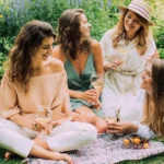 women enjoying italian garden party with fashionable dresses